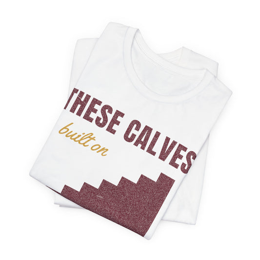 White crewneck T-shirt with diagonal "THESE CALVES" and hill graphic