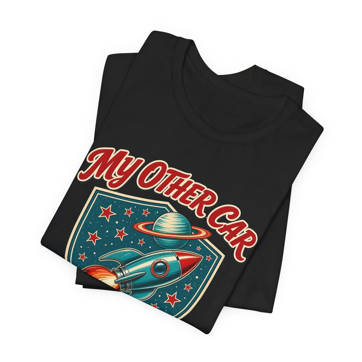 Black crewneck t-shirts stacked with colorful rocket graphic