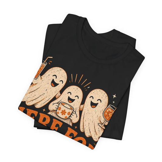 Black crewneck T-shirt, folded, with three cartoon ghosts and orange drink graphic