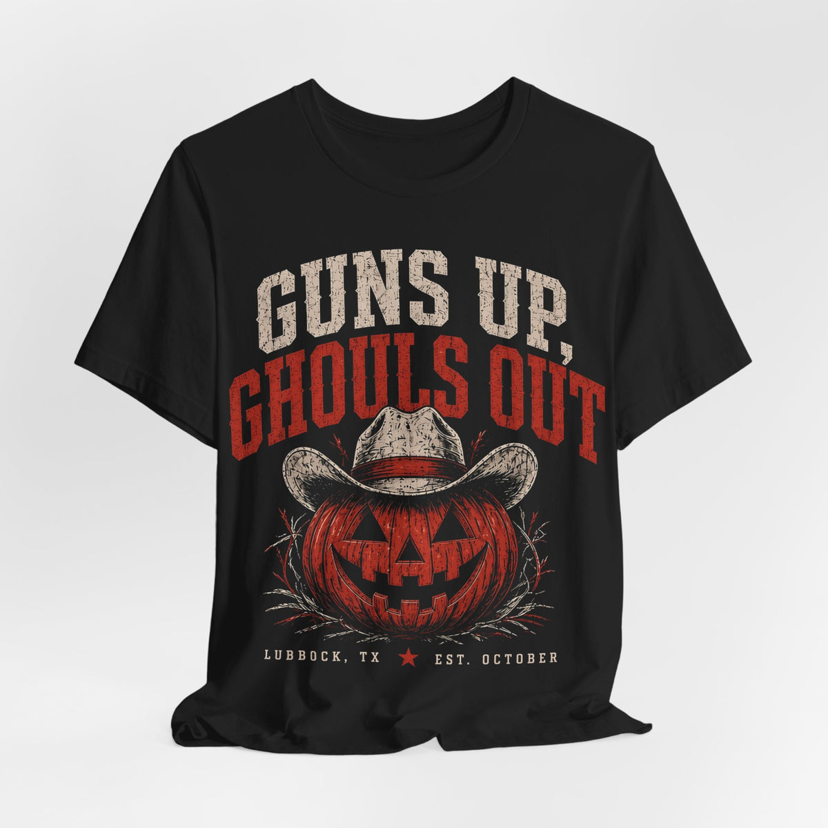 Black graphic T-shirt with cowboy-hat jack-o’-lantern and “Guns Up, Ghouls Out” text