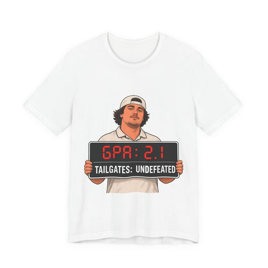 White graphic T-shirt with football player illustration and “GPA: 2.1” sign