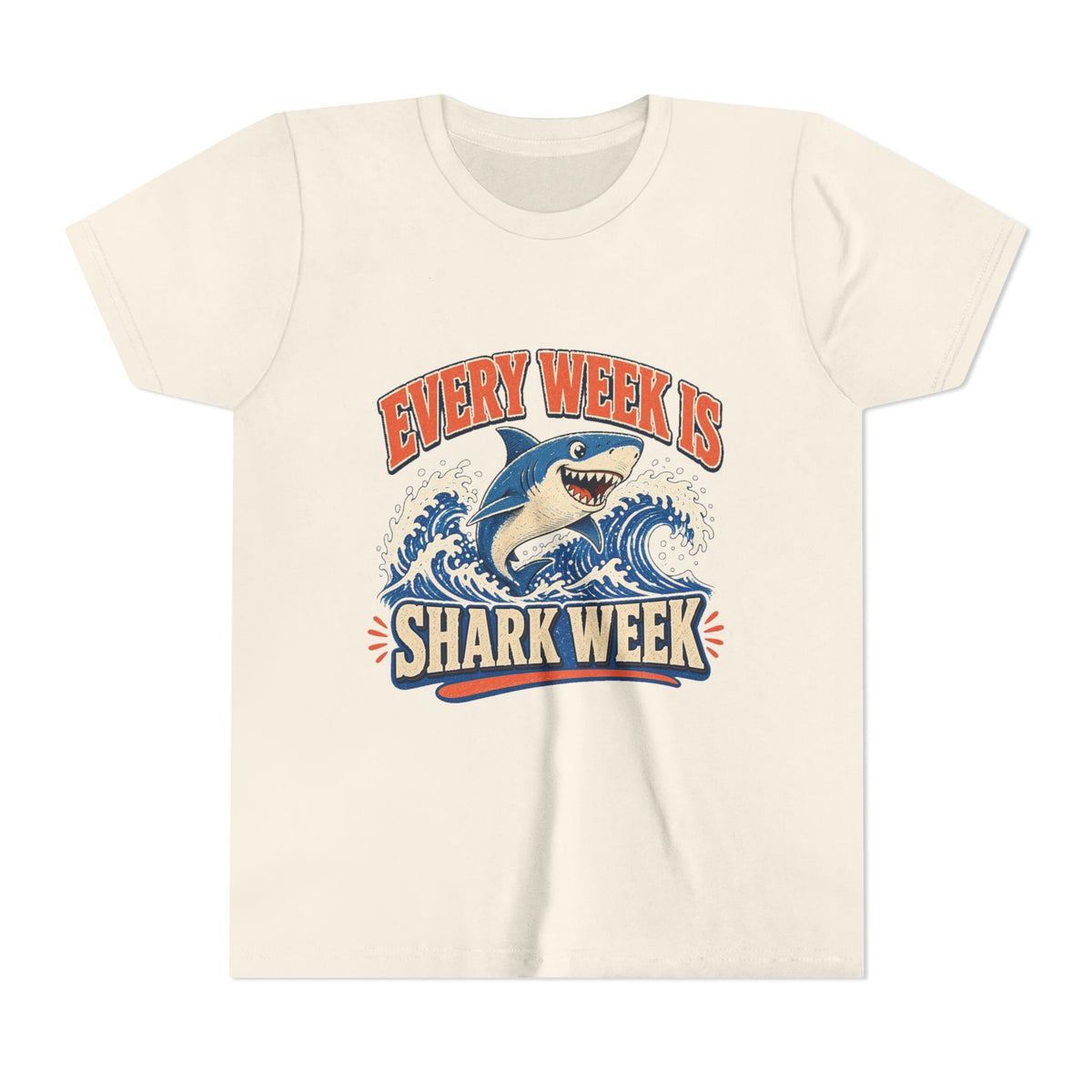 Kids graphic T-shirt, natural, front with blue shark and “Shark Week” slogan