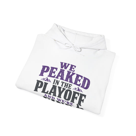 White hoodie folded with front 'WE PEAKED IN THE PLAYOFF' printed text graphic