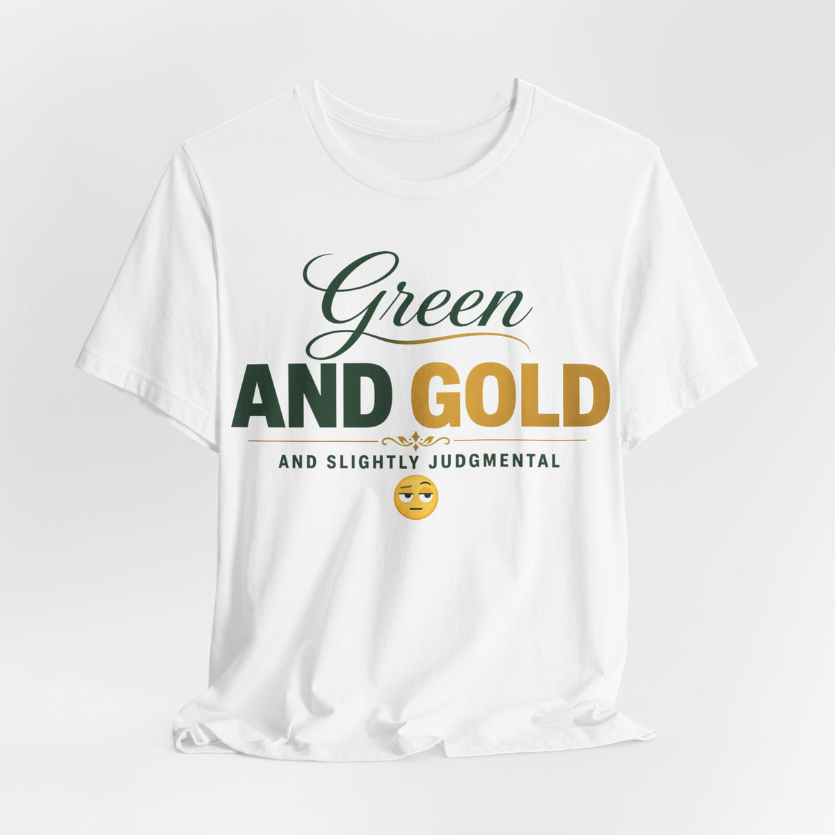 White crew-neck graphic T-shirt with Green and Gold lettering and judgmental emoji