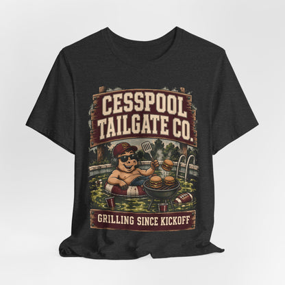 Dark heather graphic T-shirt with cartoon pitmaster and Cesspool Tailgate Co. front print