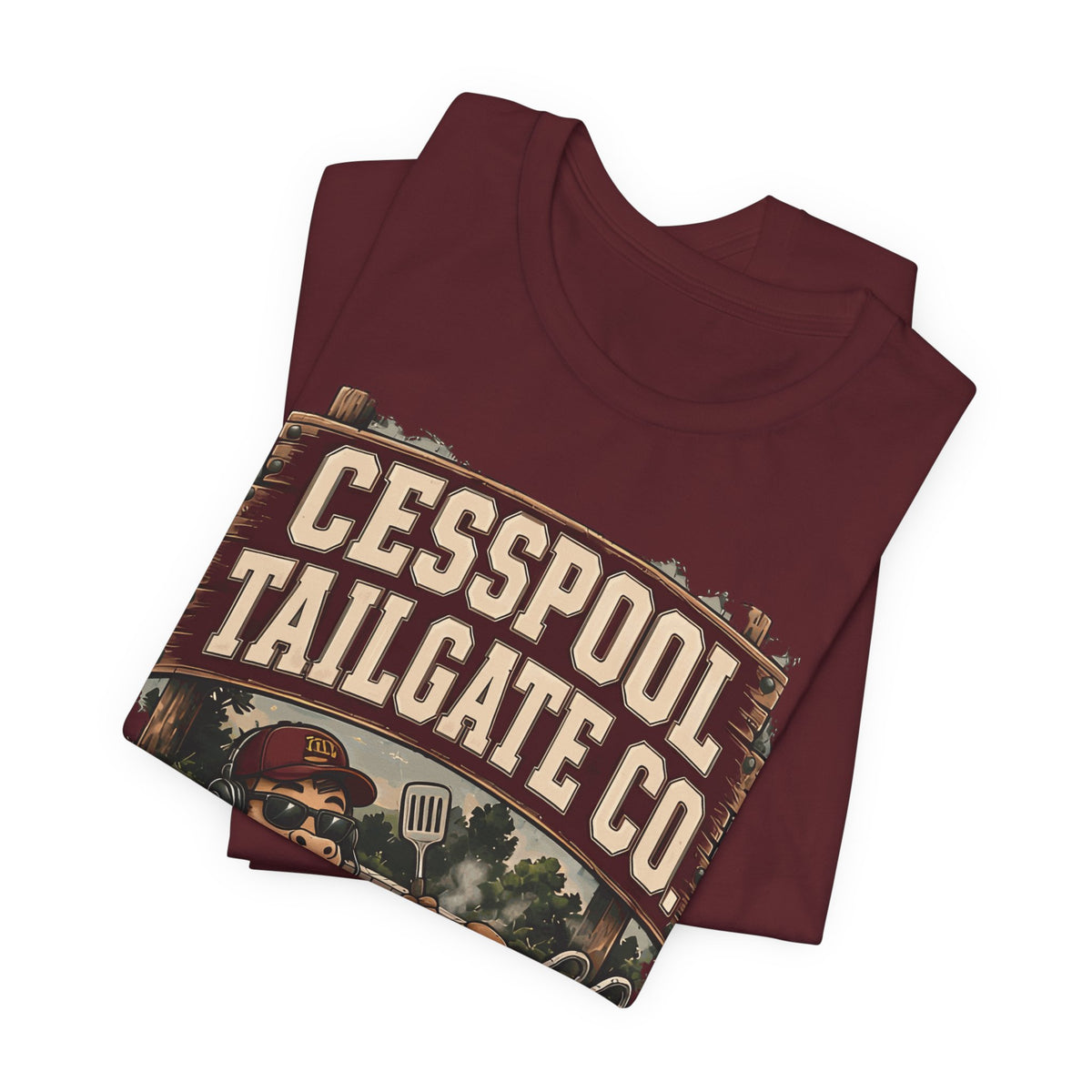 Burgundy T-shirt, folded, with large Cesspool Tailgate Co. logo and grill graphic