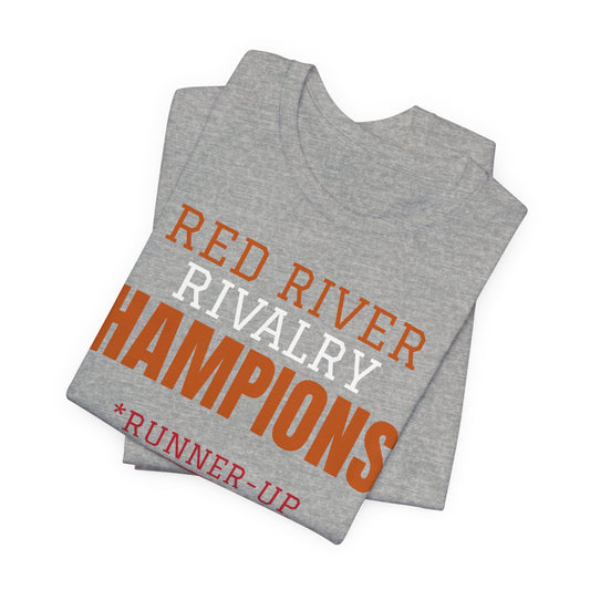 Heather gray T-shirt stack with orange 'Red River Rivalry Champions*' and runner-up print