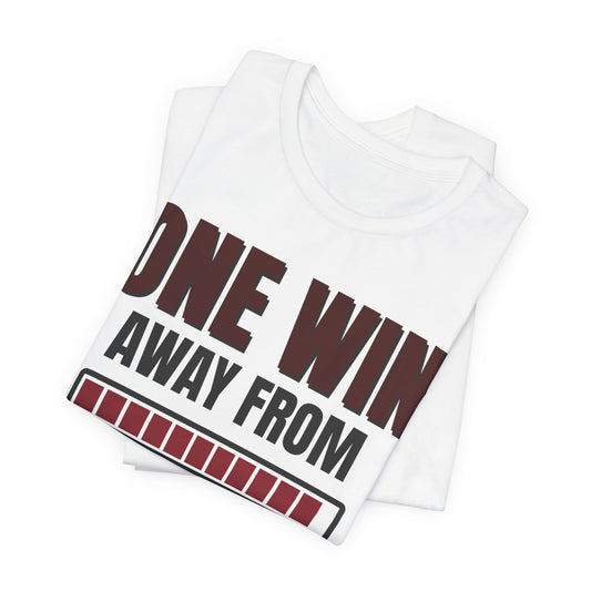 White tee with 'ONE WIN AWAY FROM' front graphic and red bar details, folded
