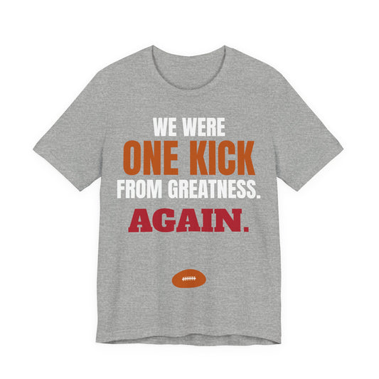 Heather gray graphic T-shirt with multicolor 'ONE KICK... AGAIN' football graphic