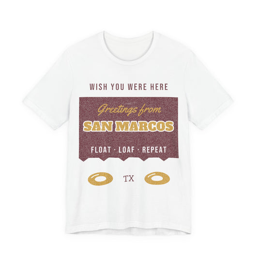White crewneck graphic tee with 'Greetings from San Marcos' print