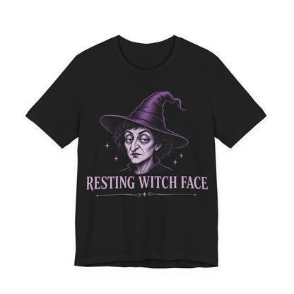 Black crewneck T-shirt with purple witch face graphic and “Resting Witch Face” text