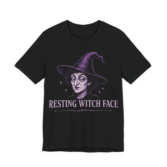 Black crewneck T-shirt with purple witch face graphic and “Resting Witch Face” text