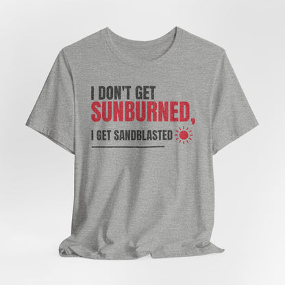 Gray crew-neck T-shirt with red 'SUNBURNED' and sunburst icon slogan graphic