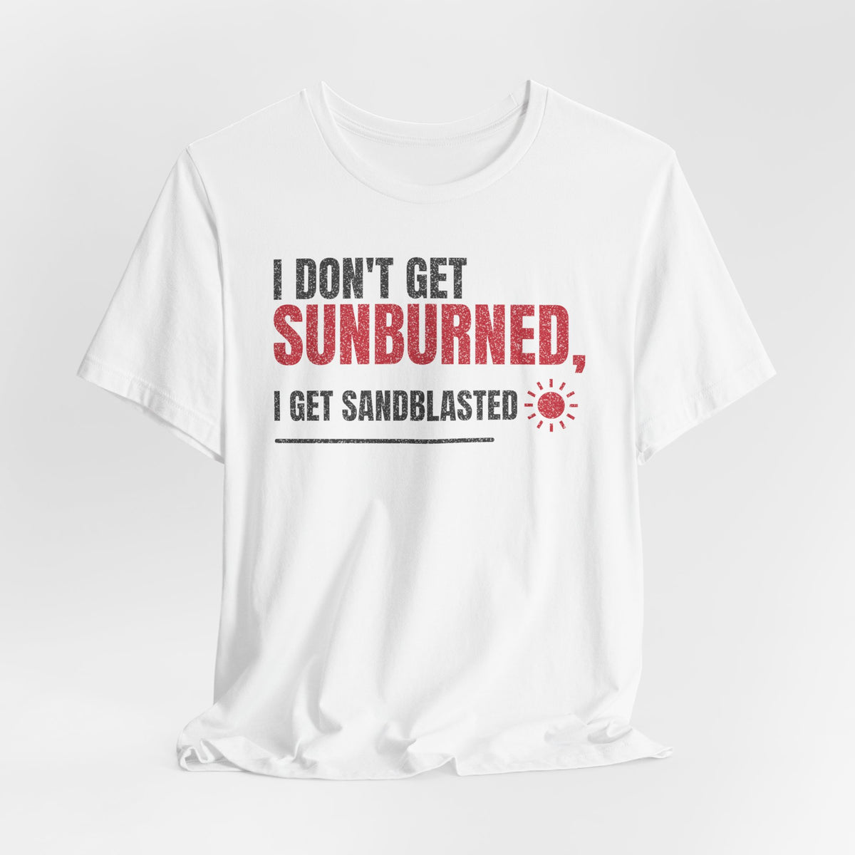 White crew-neck T-shirt with red 'SUNBURNED' text and small sun icon graphic