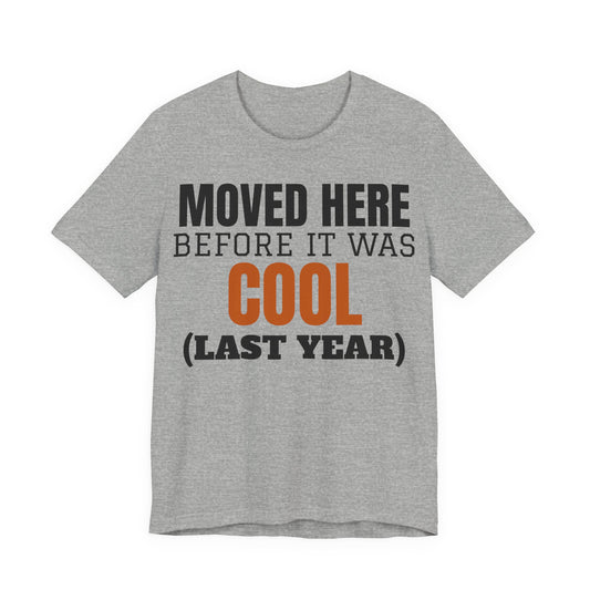 Heather gray crewneck T-shirt with "Moved Here Before It Was Cool (Last Year)" graphic