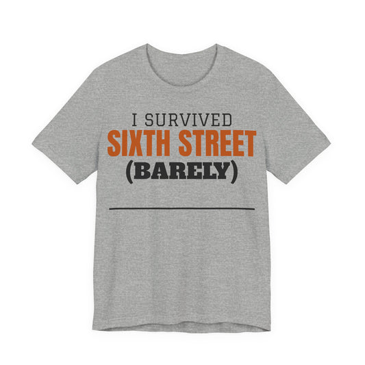 Heather gray T-shirt with orange/black 'I Survived Sixth Street (Barely)' graphic