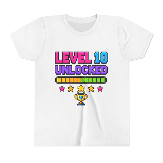 White kids crewneck tee with “LEVEL 10 UNLOCKED” game graphic and stars