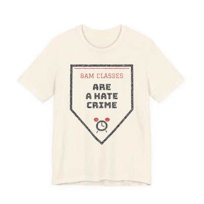 Natural/cream graphic T-shirt with '8AM CLASSES' and hate crime emblem