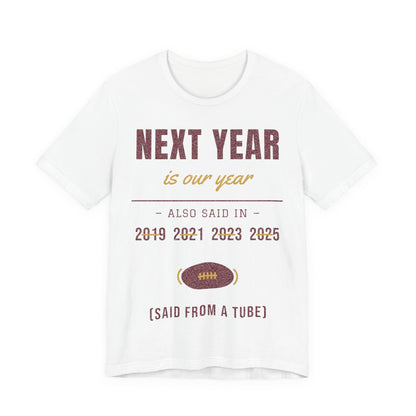 White tee with 'NEXT YEAR' graphic, years, and football icon