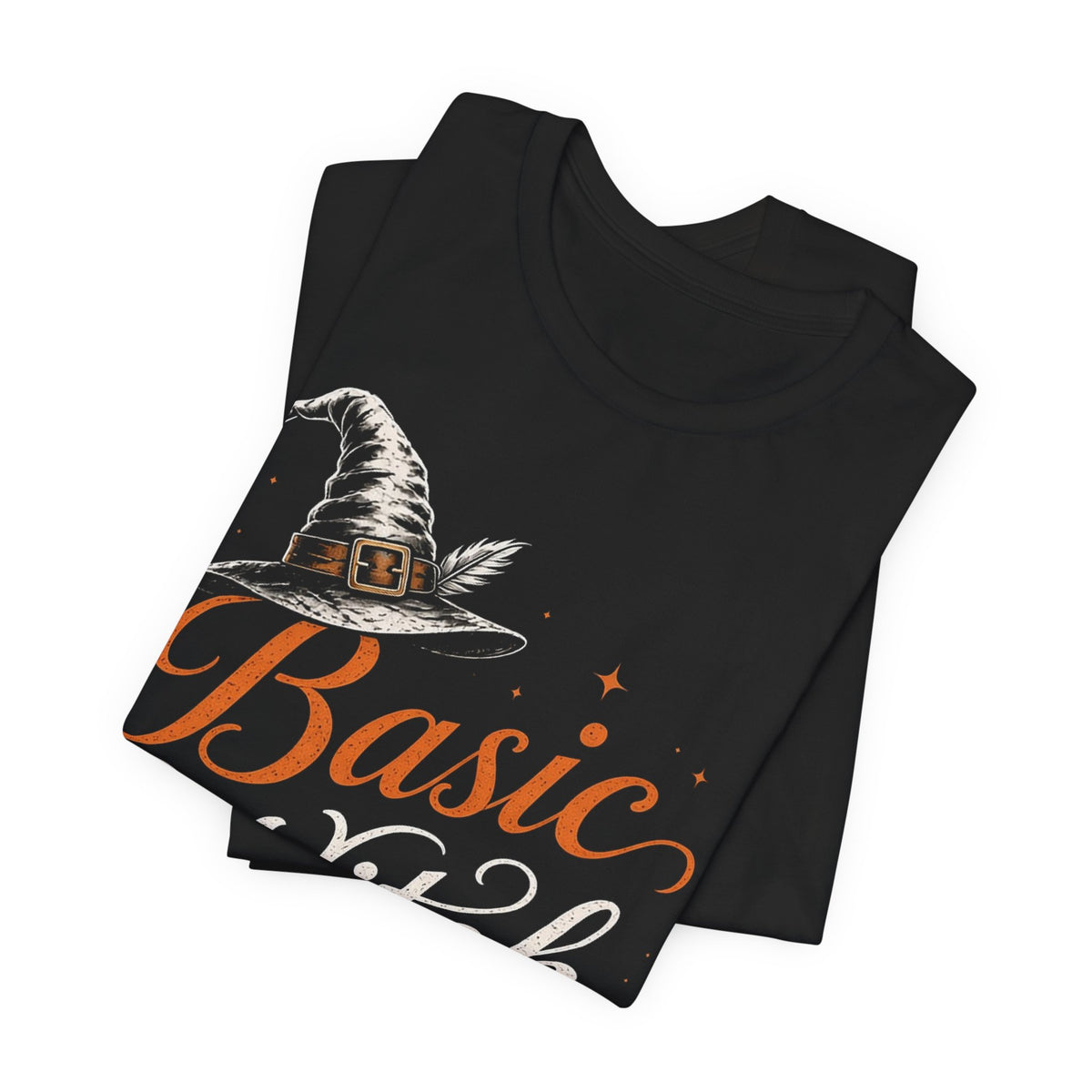 Folded black crew-neck graphic tee with witch hat and orange Basic Witch lettering