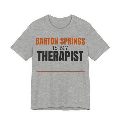 Heather gray T-shirt with orange and black 'Barton Springs is my Therapist' print