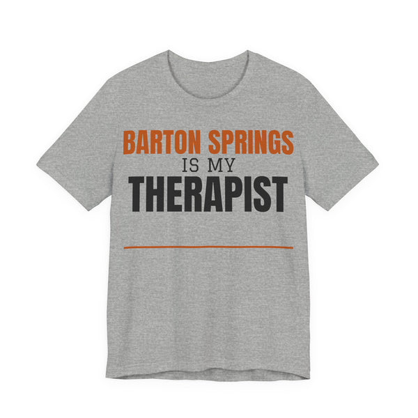 Heather gray T-shirt with orange and black 'Barton Springs is my Therapist' print