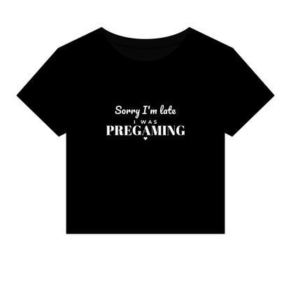 Black crop top with white slogan 'Sorry I'm late was PREGAMING'