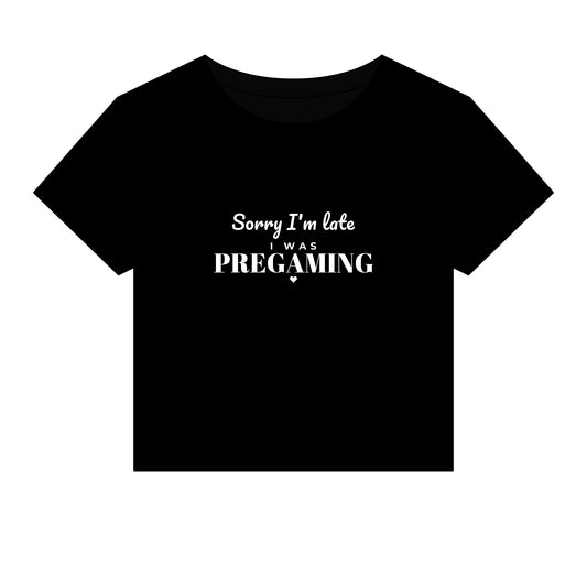Black crop top with white slogan 'Sorry I'm late was PREGAMING'