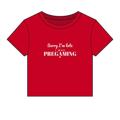 Red crop top with white slogan 'Sorry I'm late was PREGAMING'