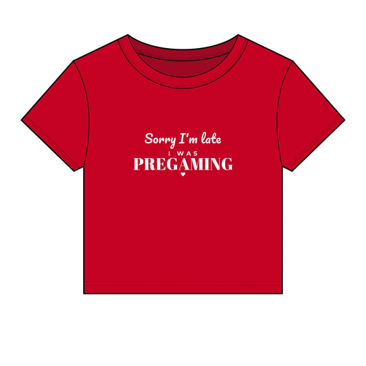 Red crop top with white slogan 'Sorry I'm late was PREGAMING'